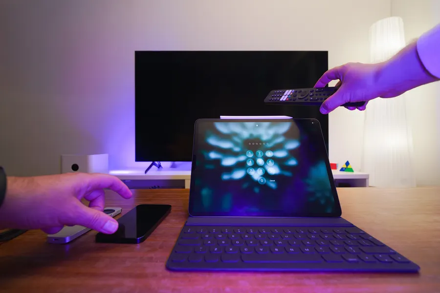 TV, tablet and remote control in a living room